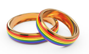 Gay Marriage Concept with Rainbow Rings.