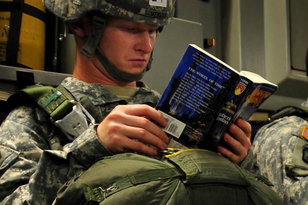 An army student reading a book. Studying for the sift test can help