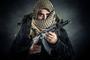 Terrorist with AK-47. Selected focus on eyes
