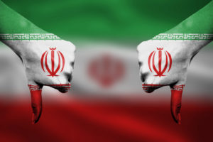 failure of Iran - hands gesturing thumbs down in front of flag