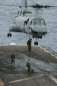 Marines attached to the 15th Marine Expeditionary Unit fast rope from a CH-46E Sea Knight helicopter onto the flight deck of amphibious assault ship USS Peleliu (LHA 5). Peleliu is the flagship for the Peleliu Amphibious Ready Group currently on deployment with amphibious transport dock ship USS Green Bay (LPD 20) and amphibious dock landing ship USS Rushmore (LSD 47). (U.S. Navy photo by Mass Communication Specialist 2nd Class Michael Thompson)