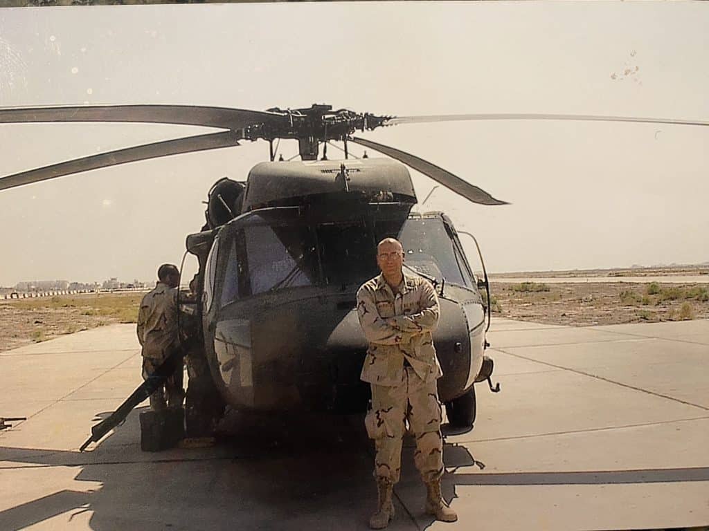 (Tallil Air Base, Iraq, 2004) I'm in front of a Medevac Blackhawk after getting to ride along as a practice patient strapped into a stretcher. It was the only time I ever flew in a helicopter in Iraq. The (U.S. Army) pilot did his best to make this Air Force “Zoomie” puke—but I found respite in the experience. Like the C-130 flight that got me there, I was forced to let go and accept my life was in someone else’s hands. That can be especially difficult for medical professionals because we’re used to it being the other way around (and why typically we're terrible patients). (Michael Warnock)
